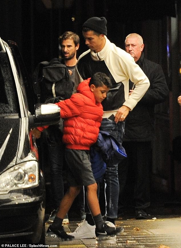 Cristiano Ronaldo arrives at a London hotel with his girlfriend Georgina Rodriguez and son Cristiano Jr (Photos)