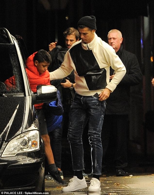 Cristiano Ronaldo arrives at a London hotel with his girlfriend Georgina Rodriguez and son Cristiano Jr (Photos)