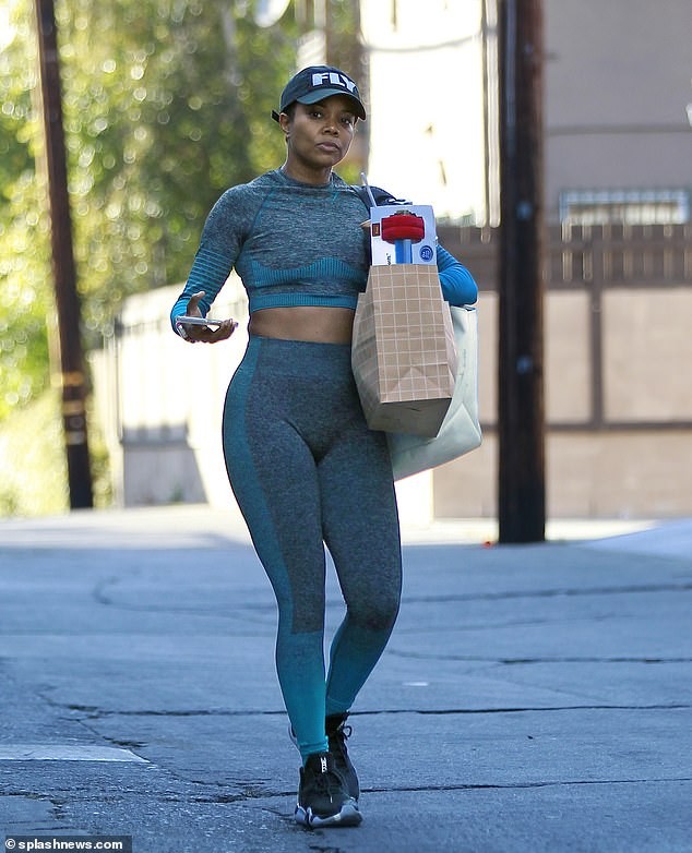Gabrielle Union flaunts her curves as she
