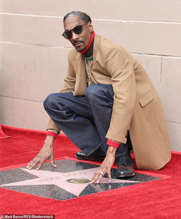 Snoop Dogg plants a sweet kiss on his wife of 21-years as he gets a star on Hollywood Walk of Fame (Photos)