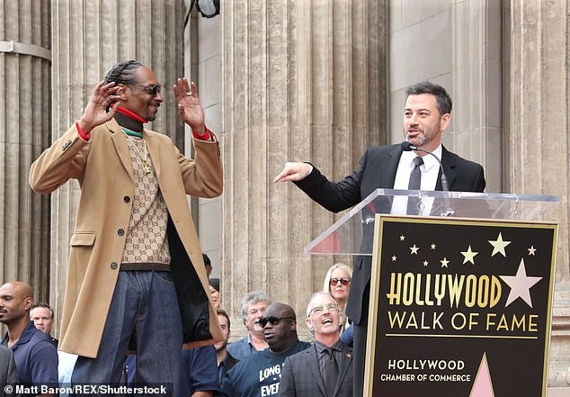 Snoop Dogg plants a sweet kiss on his wife of 21-years as he gets a star on Hollywood Walk of Fame (Photos)