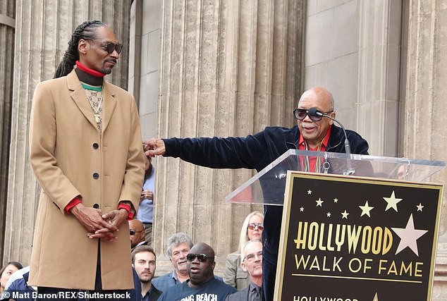Snoop Dogg plants a sweet kiss on his wife of 21-years as he gets a star on Hollywood Walk of Fame (Photos)