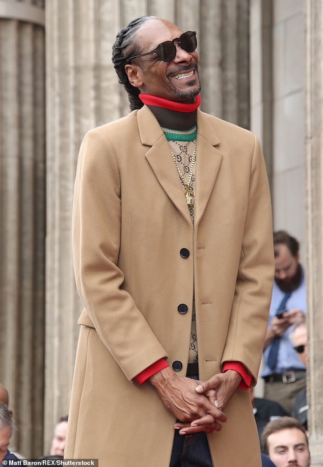 Snoop Dogg plants a sweet kiss on his wife of 21-years as he gets a star on Hollywood Walk of Fame (Photos)