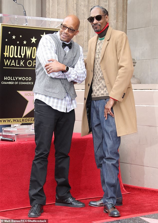 Snoop Dogg plants a sweet kiss on his wife of 21-years as he gets a star on Hollywood Walk of Fame (Photos)