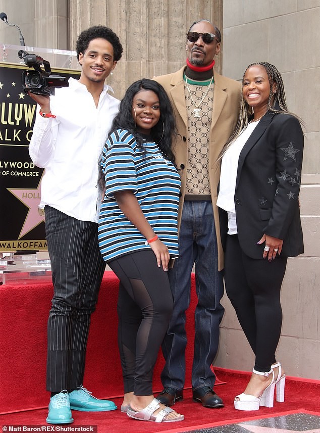 Snoop Dogg plants a sweet kiss on his wife of 21-years as he gets a star on Hollywood Walk of Fame (Photos)