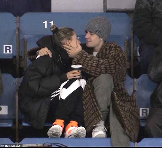 Justin Bieber and wife Hailey Baldwin cuddle up at a junior hockey game in Canada (Photos)