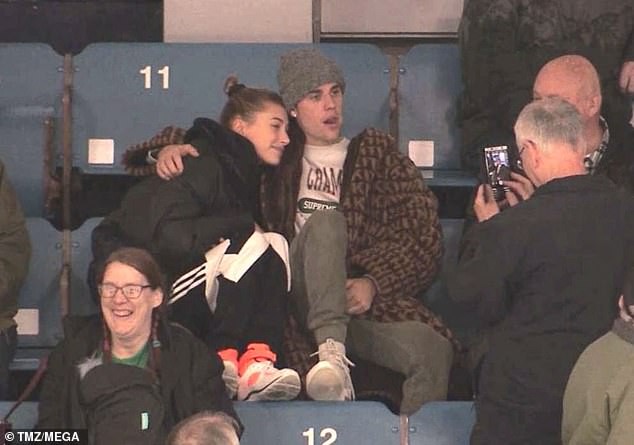 Justin Bieber and wife Hailey Baldwin cuddle up at a junior hockey game in Canada (Photos)
