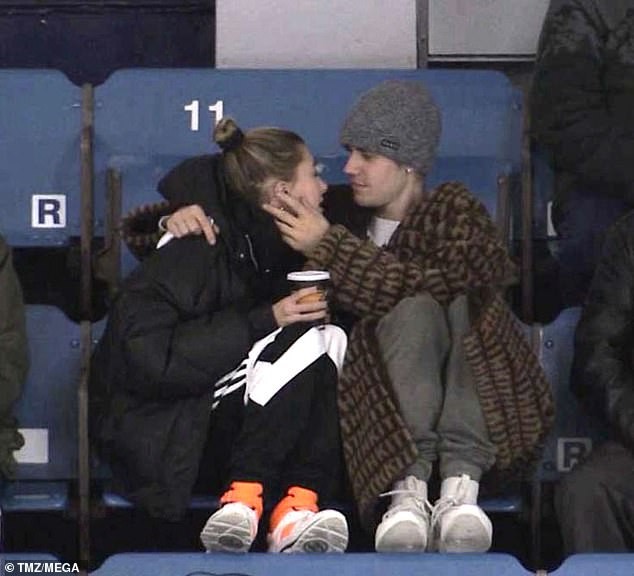 Justin Bieber and wife Hailey Baldwin cuddle up at a junior hockey game in Canada (Photos)