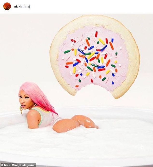 Nicki Minaj flaunts her curvy backside in a bubble bath to promote her latest single