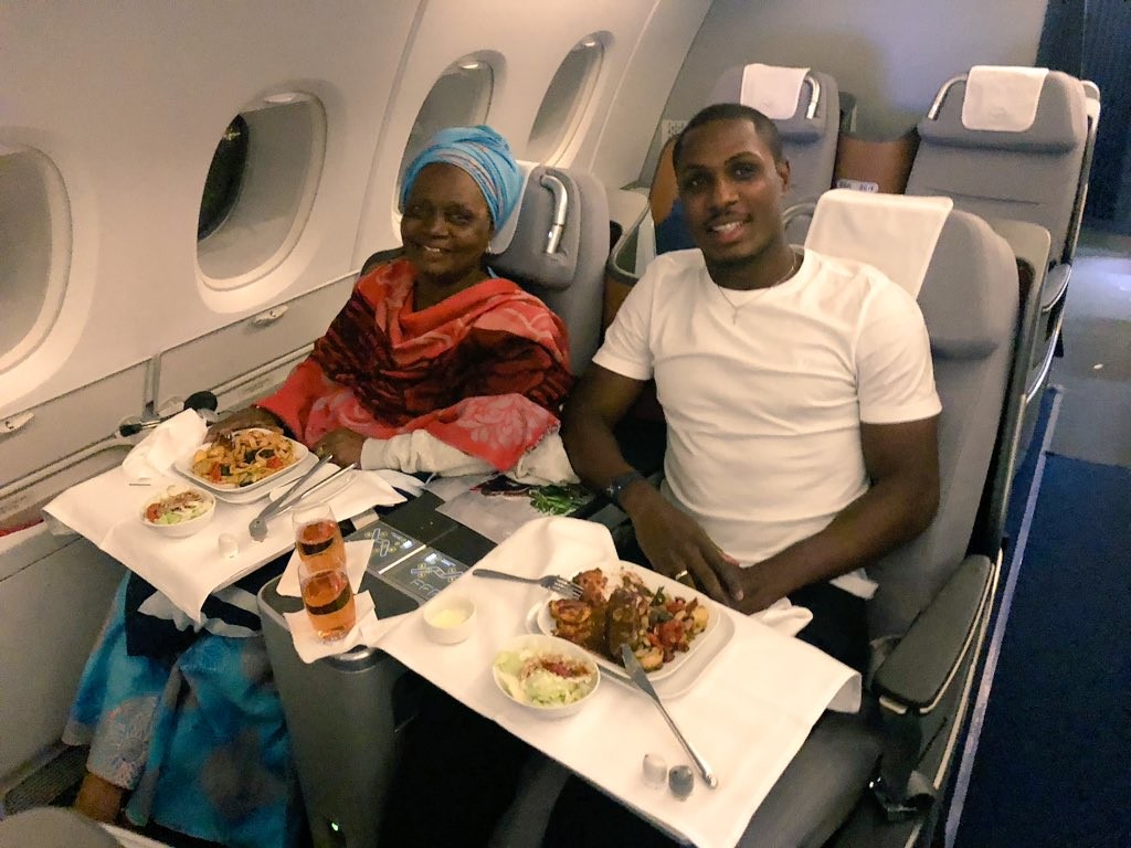 Super Eagles striker, Odion Ighalo shares rare photos with his mom inside a plane?