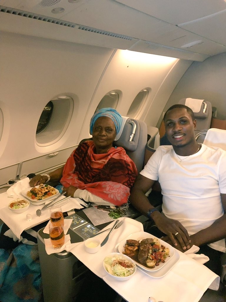 Super Eagles striker, Odion Ighalo shares rare photos with his mom inside a plane?