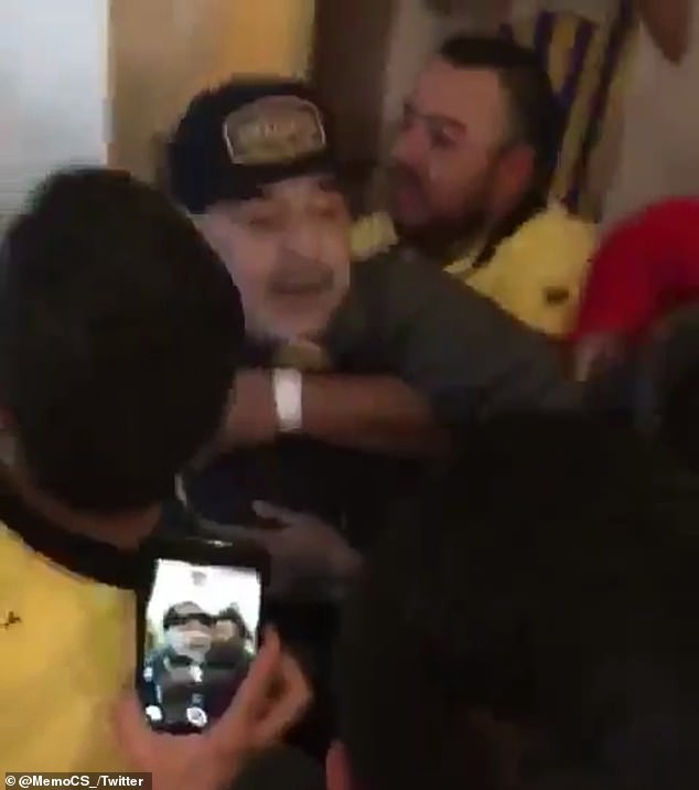 Football legend Diego Maradona throws a punch at a reporter after his team lost?the Ascenso MX play-off final (Video)