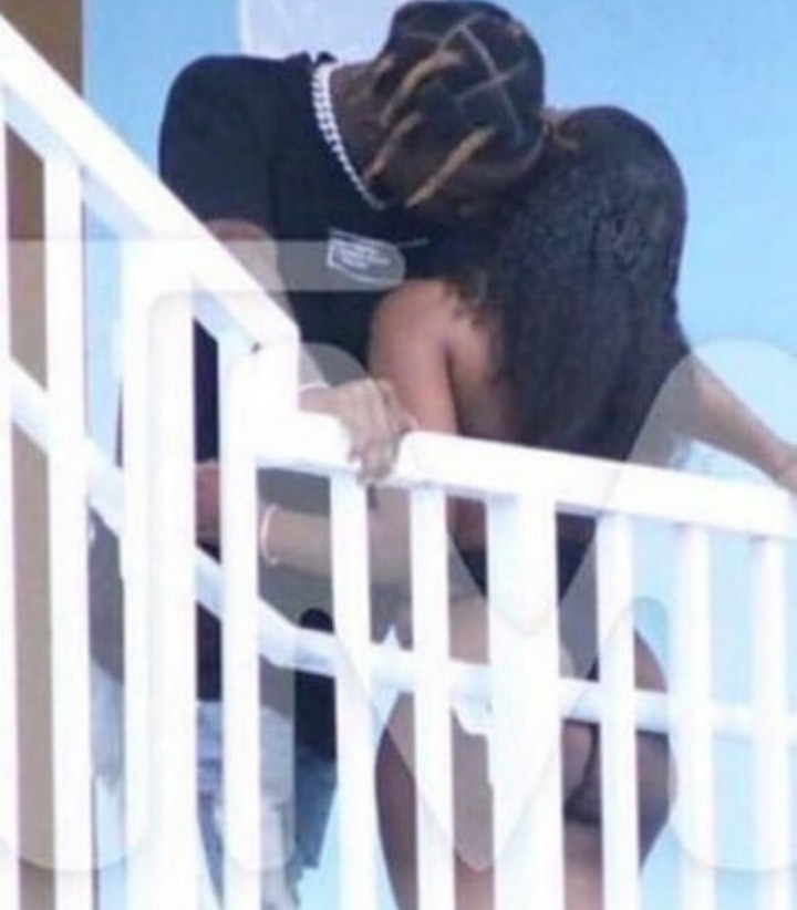 Travis Scott denies cheating rumors after someone who looks exactly like him was photographed cuddling a woman who isn