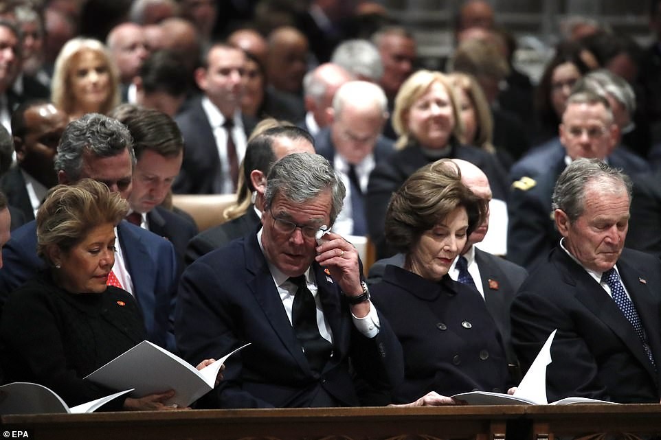 Former US president George W. Bush breaks down in tears as he says farewell to his late father George H.W. Bush at his funeral service. (Photos)