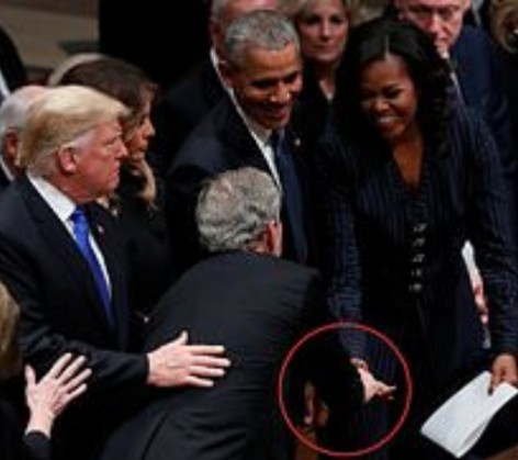 Adorable moment George W. Bush gave Michelle Obama candy just before his father