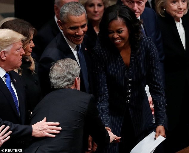 Adorable moment George W. Bush gave Michelle Obama candy just before his father