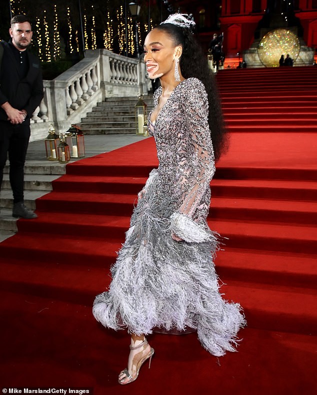 Model Winnie Harlow flaunts her stunning ?figure as she attends the British Fashion Awards in a beautiful feathered gown (Photos)