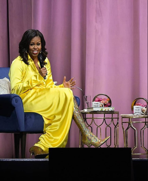Michelle Obama makes lasting fashion statement as she steps out in a ,000 glittery thigh-high Balenciaga boots and yellow gown (photos)