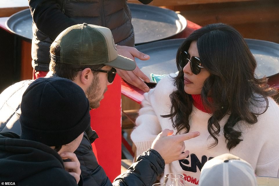 Priyanka Chopra plants a sweet kiss on her husband Nick Jonas as they enjoy lunch date with family and friends (Photos)