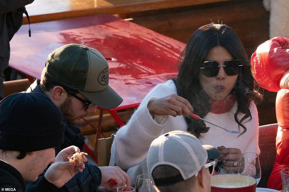 Priyanka Chopra plants a sweet kiss on her husband Nick Jonas as they enjoy lunch date with family and friends (Photos)