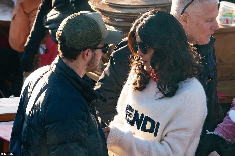 Priyanka Chopra plants a sweet kiss on her husband Nick Jonas as they enjoy lunch date with family and friends (Photos)