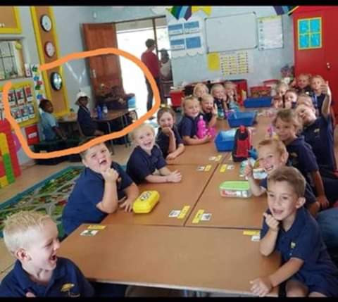 Update: Teacher suspended over disturbing photo of black pupils allocated a table away from their white classmates in SA
