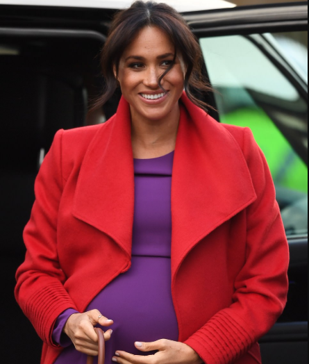 Meghan Markle lets slip her baby will arrive in April as she and Harry arrive in Birkenhead