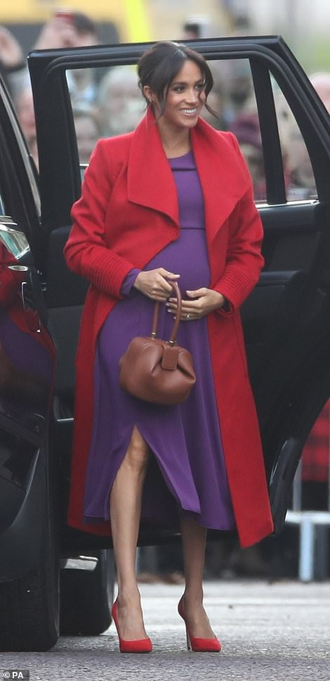 Meghan Markle lets slip her baby will arrive in April as she and Harry arrive in Birkenhead 