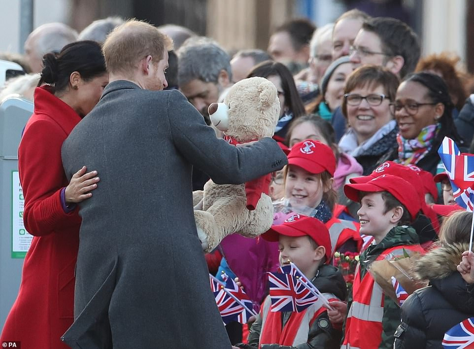 Meghan Markle lets slip her baby will arrive in April as she and Harry arrive in Birkenhead 