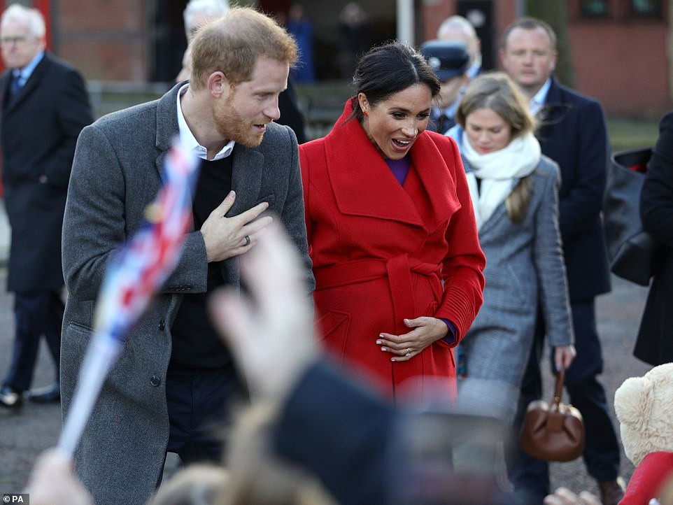 Meghan Markle lets slip her baby will arrive in April as she and Harry arrive in Birkenhead 