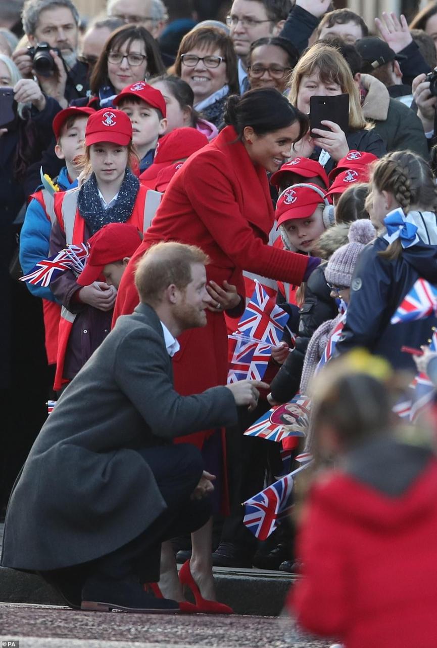 Meghan Markle lets slip her baby will arrive in April as she and Harry arrive in Birkenhead 