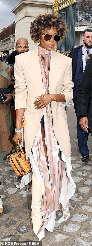  Naomi Campbell suffers wardrobe malfunction as she exposes her underwear at Louis Vuitton