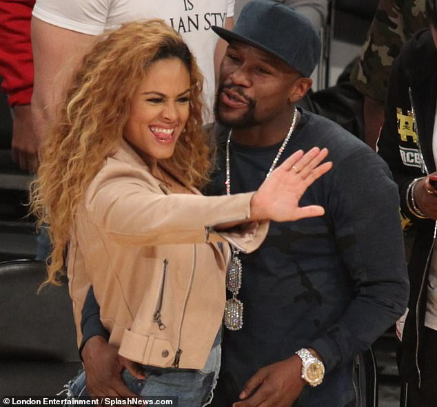Floyd Mayweather cosies up to a stunning mystery lady at LA Lakers vs Minnesota Timberwolves clash at Staples Center (Photos)