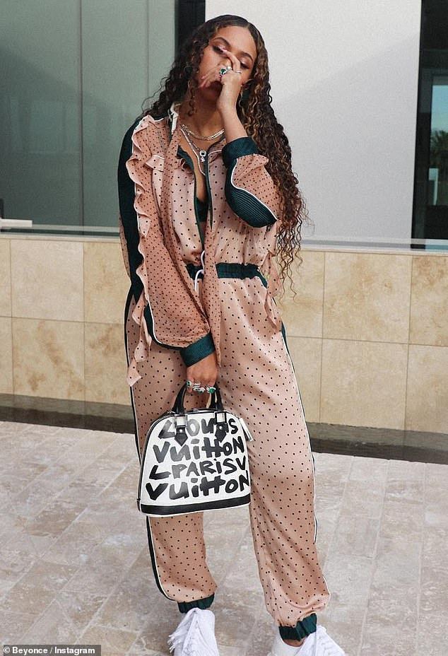 Beyonce flaunts her cleavage as she poses in a polka dot jumpsuit and diamonds in new sexy photos