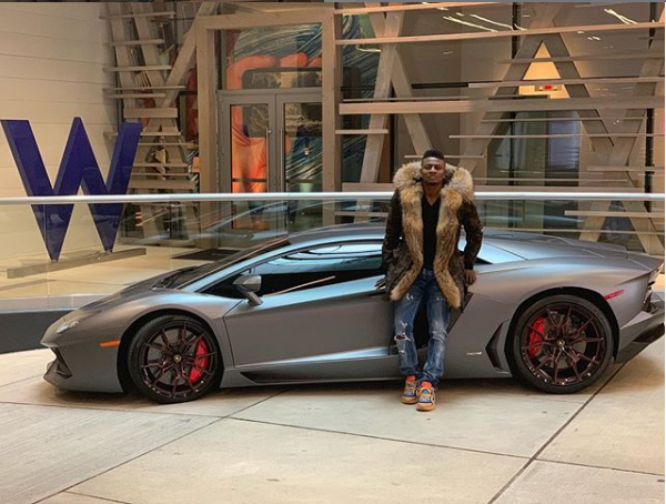 Nigerian footballer, Obafemi Martins shows off his new whip Ferrari Spider