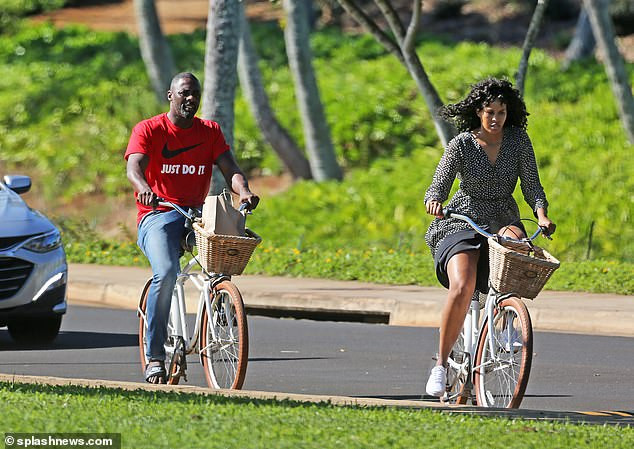 Idris Elba enjoys a romantic bike ride with his stunning fianc?e Sabrina Dhowre during their Hawaii break (Photos)
