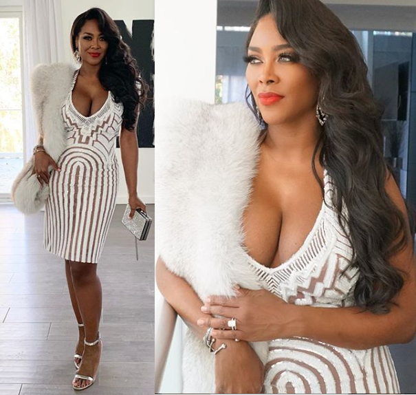Kenya Moore flaunts plenty of cleavage in sexy white lace dress (Photos)