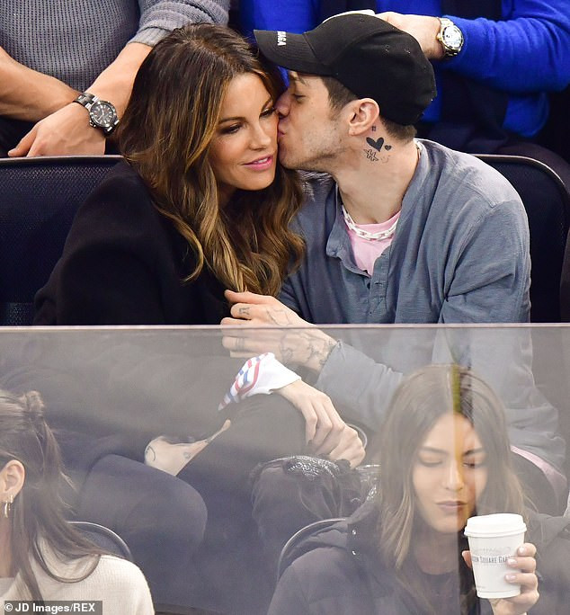 Kate Beckinsale, 45, and Pete Davidson, 25, confirm romance by passionately kissing in the stands at hockey game (Photos)