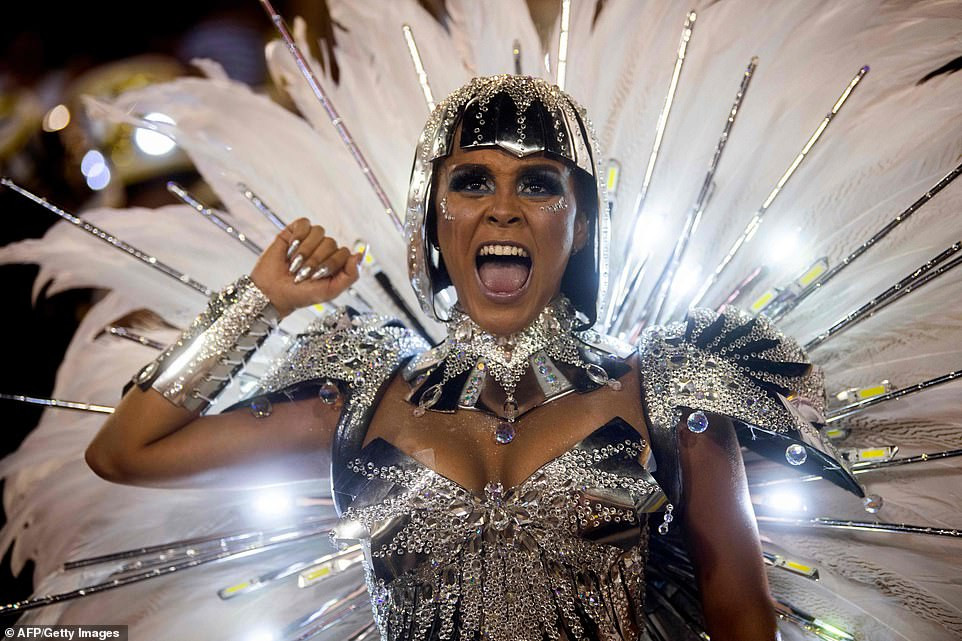 See photos from Rio de Janeiro carnival as thousands of Brazilian dancers parade their assets in sparkly G-strings