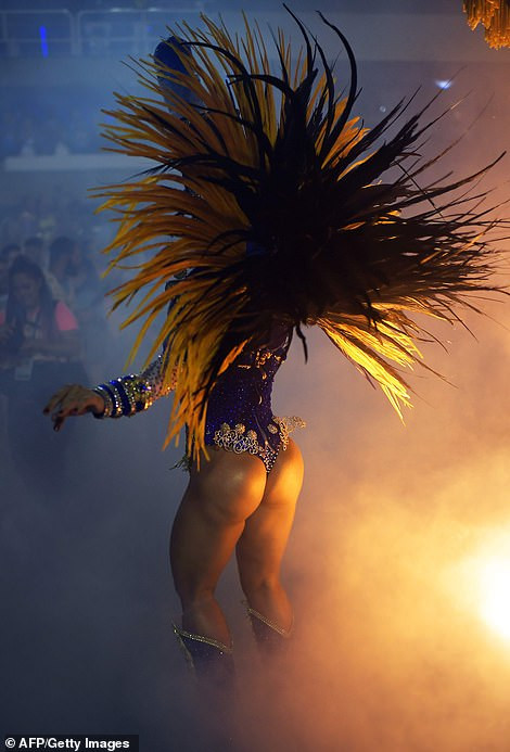 See photos from Rio de Janeiro carnival as thousands of Brazilian dancers parade their assets in sparkly G-strings
