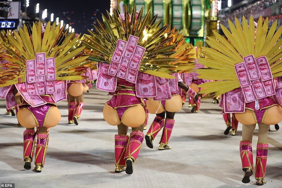 See photos from Rio de Janeiro carnival as thousands of Brazilian dancers parade their assets in sparkly G-strings