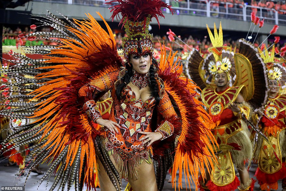 See photos from Rio de Janeiro carnival as thousands of Brazilian dancers parade their assets in sparkly G-strings