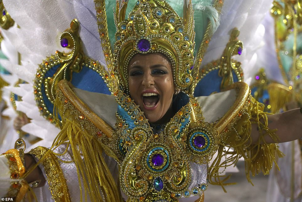 See photos from Rio de Janeiro carnival as thousands of Brazilian dancers parade their assets in sparkly G-strings