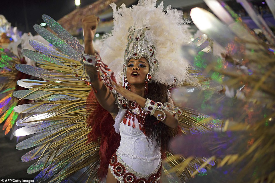 See photos from Rio de Janeiro carnival as thousands of Brazilian dancers parade their assets in sparkly G-strings
