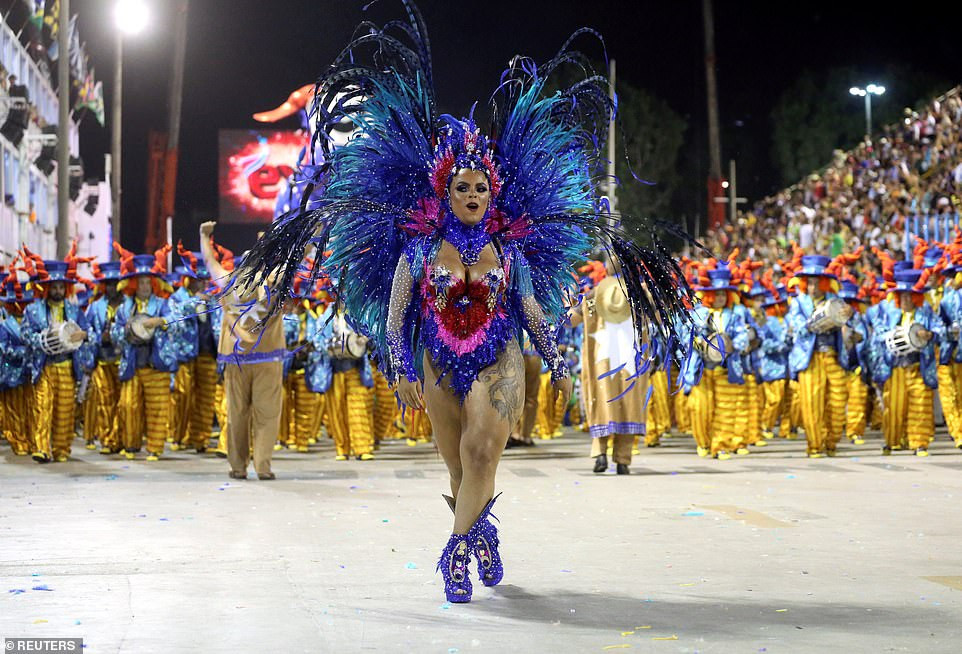 See photos from Rio de Janeiro carnival as thousands of Brazilian dancers parade their assets in sparkly G-strings
