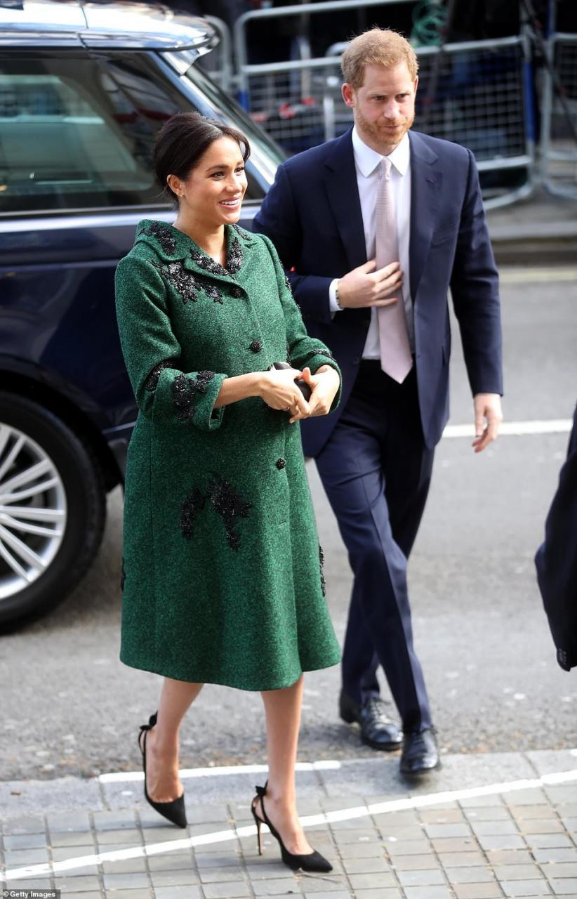 Pregnant Meghan Markle steps out in towering heels as she accompanies Prince Harry to event