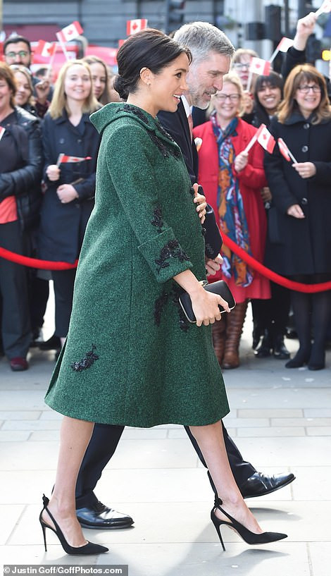 Pregnant Meghan Markle steps out in towering heels as she accompanies Prince Harry to event