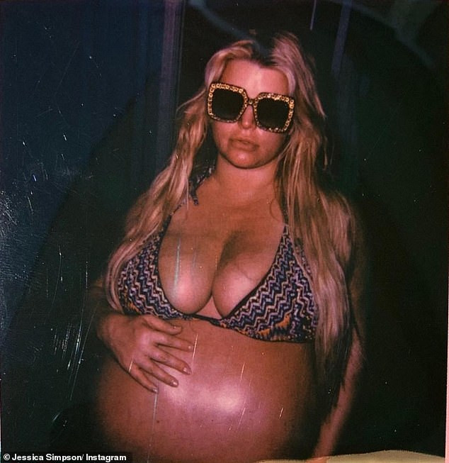Heavily pregnant Jessica Simpson shows off her very large bump in a bikini photo