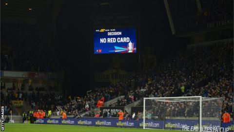 The big screen at Wolves versus Manchester United displays a VAR decision