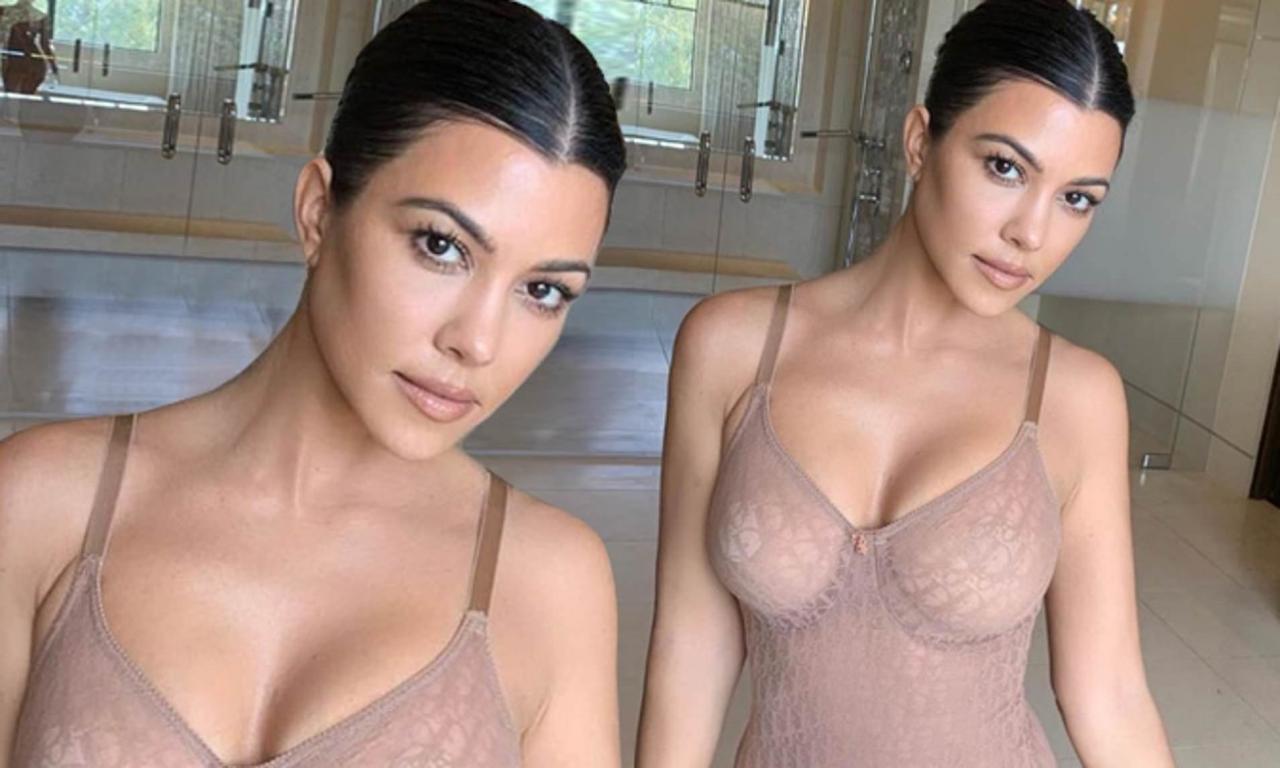 Kourtney Kardashian flaunts her ample assets as she poses in nude Christian Dior bodysuit? (Photos)